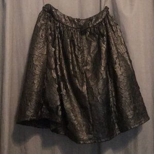 Black skirt, not tight, flower detail